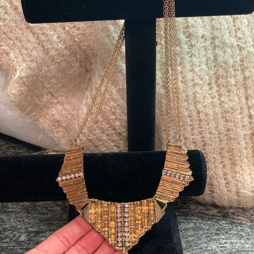 Gold tone necklace with diamond-like stones